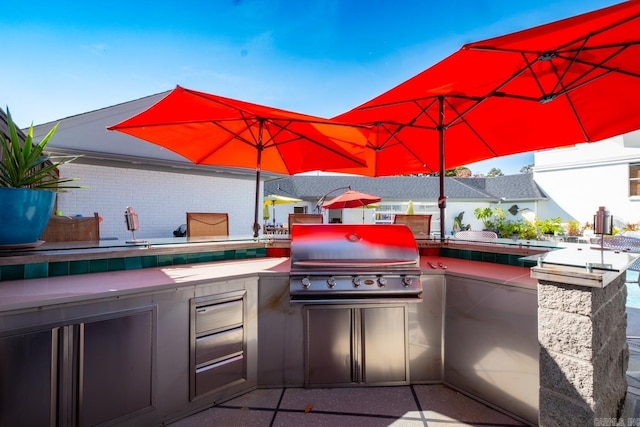 view of patio / terrace with an outdoor kitchen and grilling area