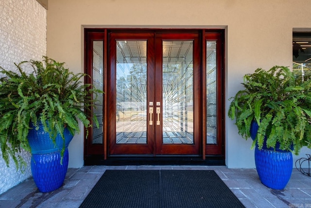 doorway to property featuring french doors