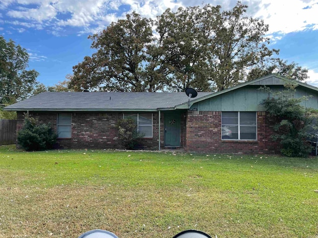 ranch-style house with a front lawn