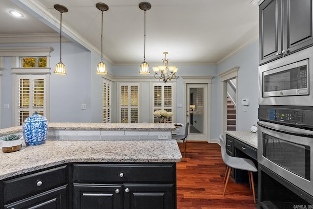 kitchen featuring ornamental molding, light stone countertops, stainless steel appliances, and dark wood-type flooring