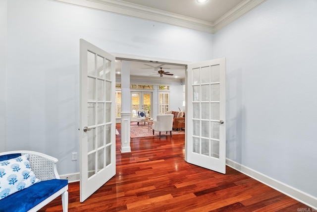 interior space with hardwood / wood-style floors, french doors, crown molding, and ceiling fan