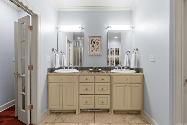 bathroom featuring vanity and crown molding