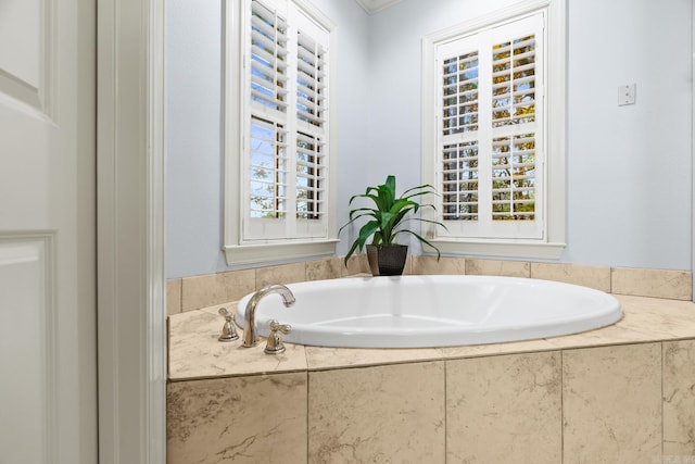 bathroom featuring tiled bath