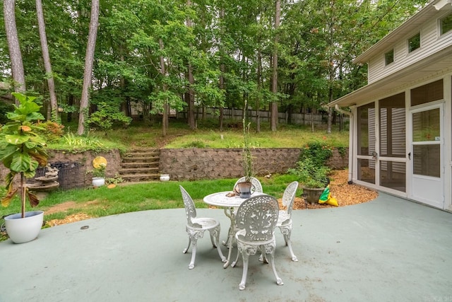 view of patio / terrace with a sunroom