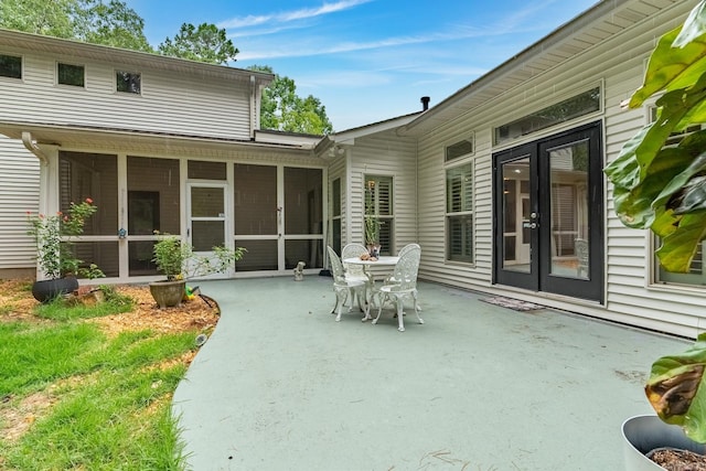 view of patio featuring a sunroom