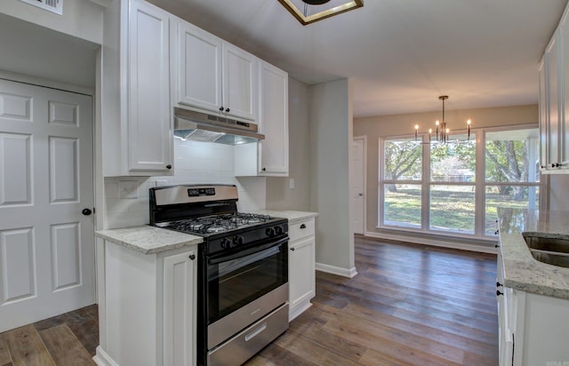 kitchen featuring white cabinets, decorative light fixtures, dark hardwood / wood-style floors, and gas range