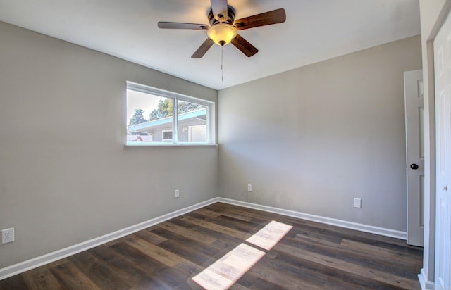 unfurnished room featuring ceiling fan and dark hardwood / wood-style floors