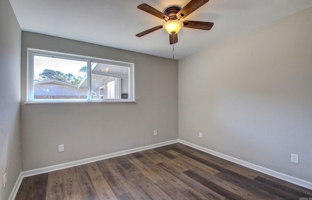 spare room with ceiling fan and dark hardwood / wood-style floors