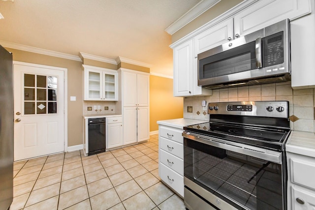 kitchen featuring decorative backsplash, white cabinetry, and stainless steel appliances