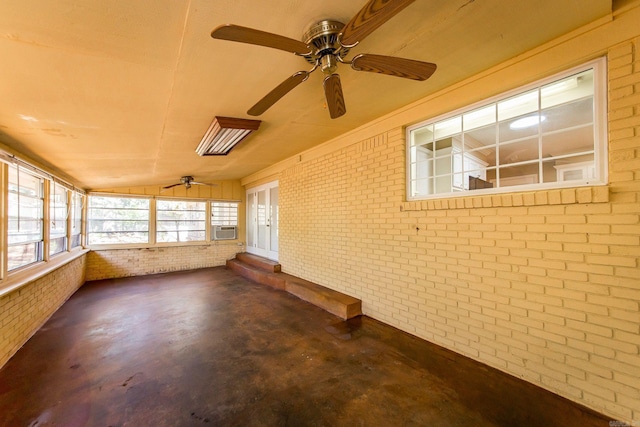 unfurnished sunroom with cooling unit, vaulted ceiling, and ceiling fan