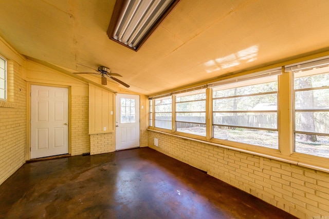 unfurnished sunroom featuring lofted ceiling and ceiling fan