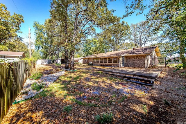 view of yard with a wooden deck