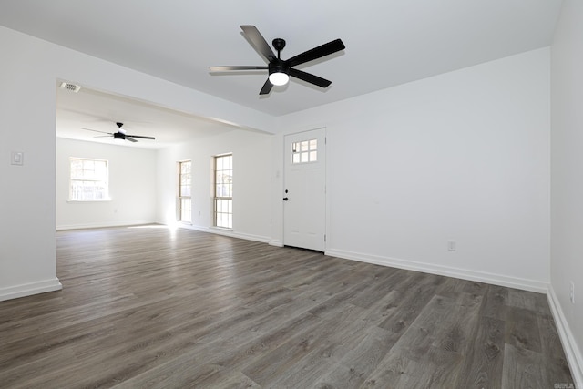 spare room with ceiling fan and dark hardwood / wood-style flooring