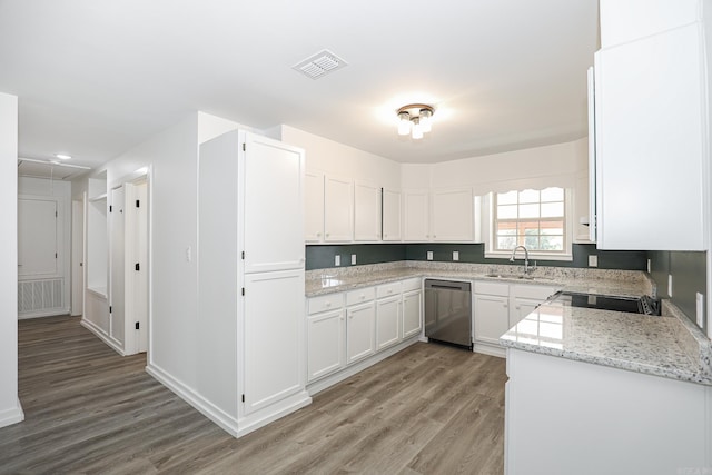 kitchen with dishwasher, sink, light stone countertops, white cabinets, and light hardwood / wood-style floors