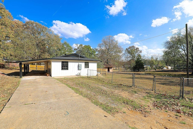 exterior space with a carport