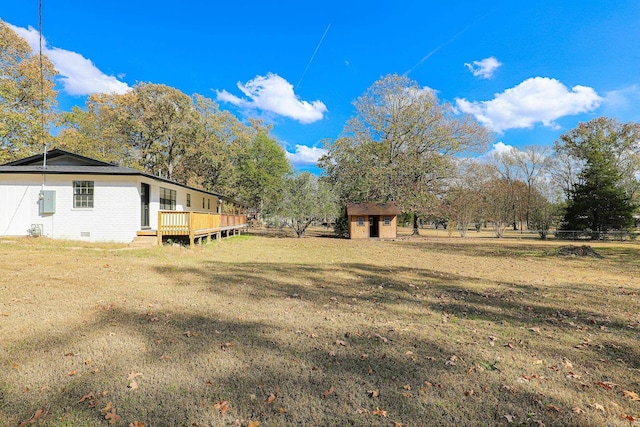 view of yard featuring a wooden deck