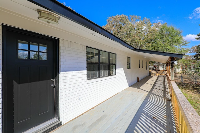 doorway to property with a wooden deck