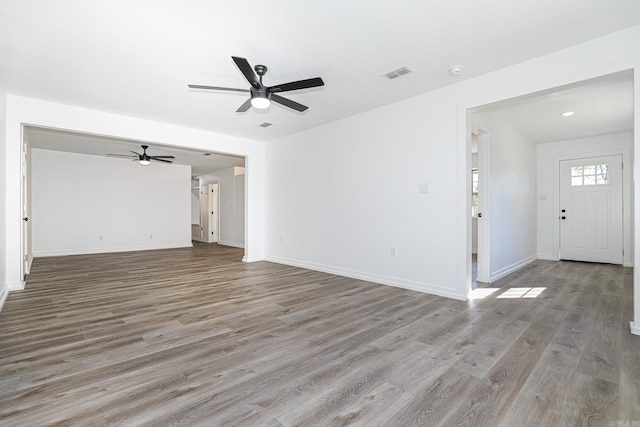 unfurnished living room with light hardwood / wood-style floors and ceiling fan