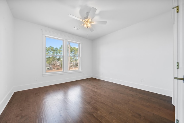 empty room featuring ceiling fan and dark hardwood / wood-style floors