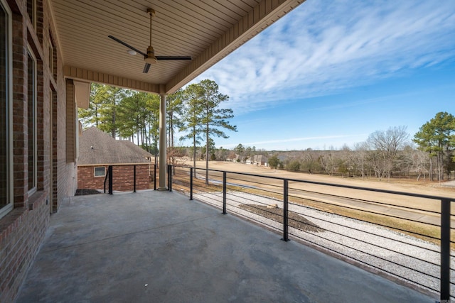 view of patio featuring ceiling fan