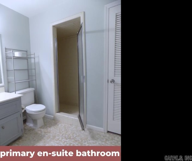 bathroom with vanity, an enclosed shower, toilet, and tile patterned floors