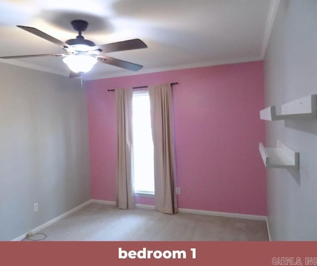 unfurnished room featuring ceiling fan and crown molding