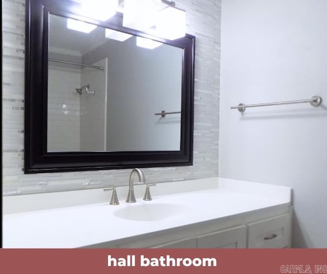 bathroom with vanity and a shower