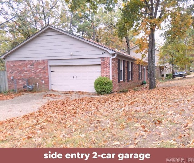 view of side of home featuring a garage