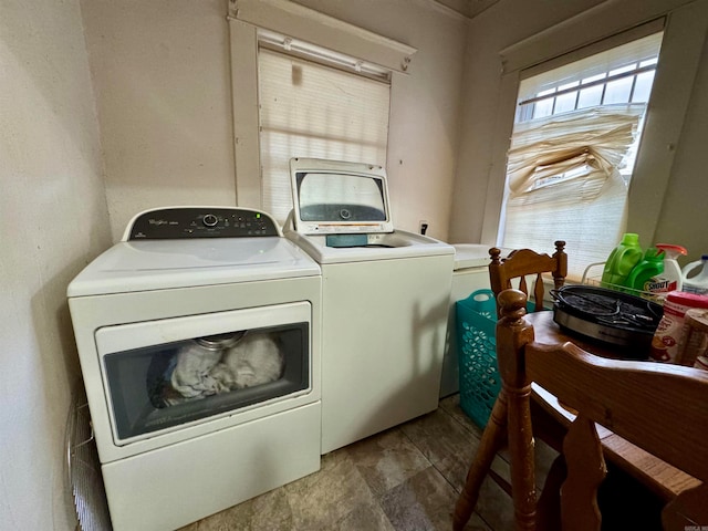 washroom featuring washer and clothes dryer