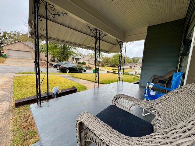 view of patio with an outdoor structure and a garage