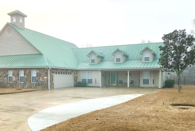 view of front facade with a garage and covered porch