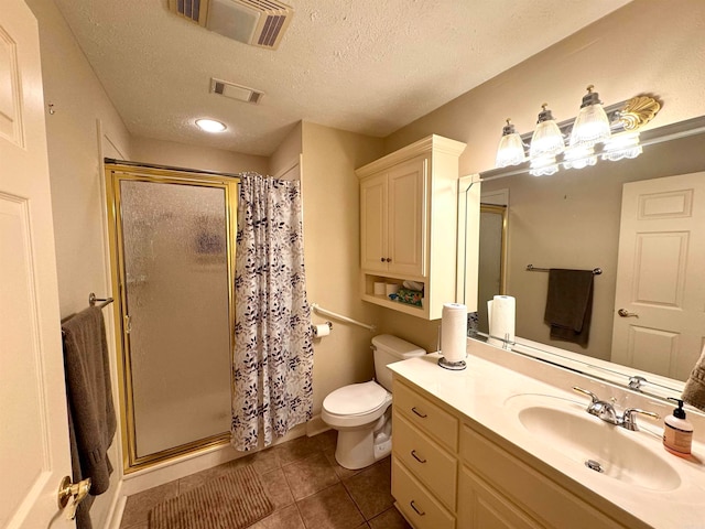 bathroom with toilet, an enclosed shower, a textured ceiling, vanity, and tile patterned flooring