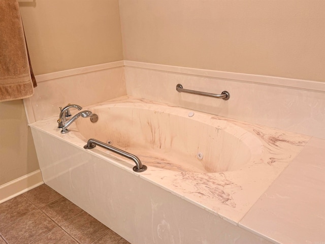 bathroom featuring a bathing tub and tile patterned flooring