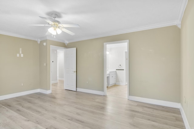 spare room featuring crown molding, light hardwood / wood-style floors, and ceiling fan