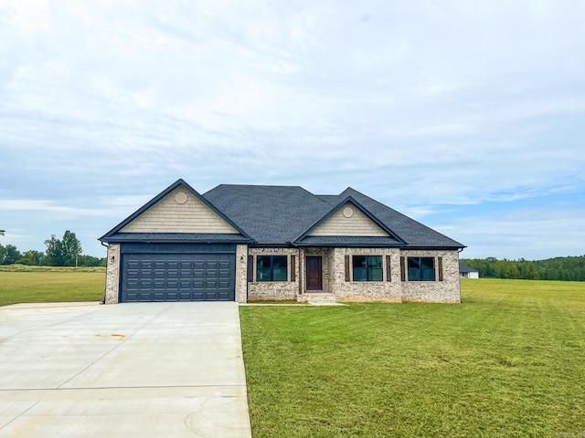 view of front facade featuring a front yard and a garage