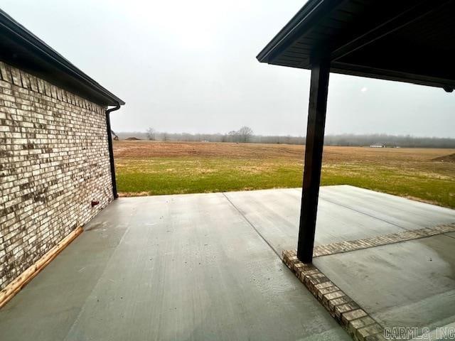 view of patio / terrace featuring a rural view