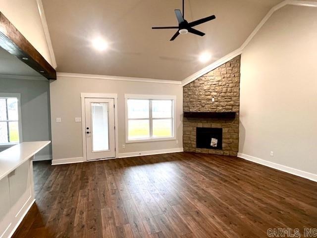 unfurnished living room with ornamental molding, dark hardwood / wood-style floors, and a healthy amount of sunlight