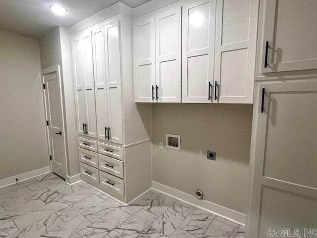 laundry room with hookup for an electric dryer, washer hookup, and cabinets