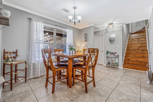 dining room with ornamental molding, a chandelier, and light tile patterned flooring