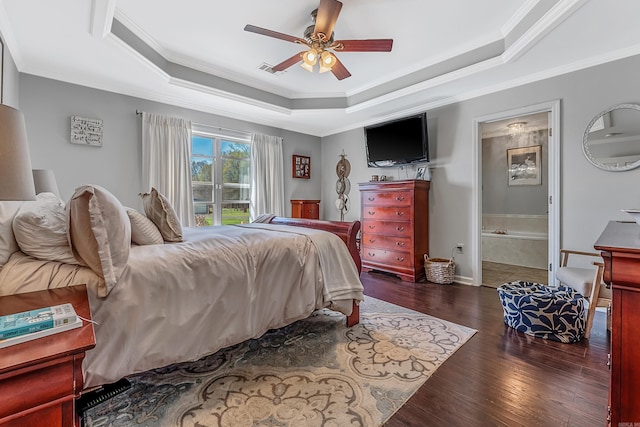 bedroom featuring dark wood-type flooring, ceiling fan, crown molding, and ensuite bath