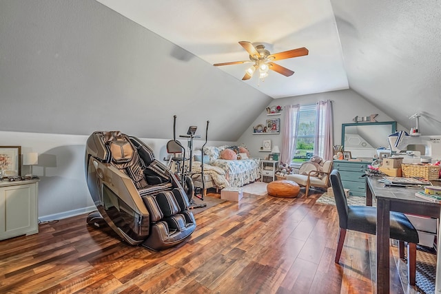 bedroom featuring lofted ceiling, a textured ceiling, hardwood / wood-style flooring, and ceiling fan