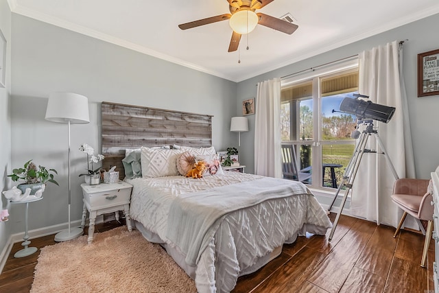 bedroom featuring dark hardwood / wood-style flooring, crown molding, and ceiling fan