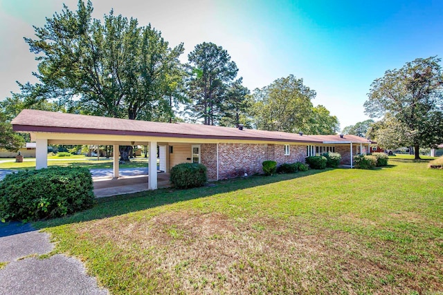 ranch-style home featuring a front yard