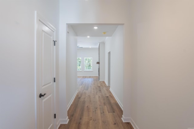 hall with light hardwood / wood-style floors