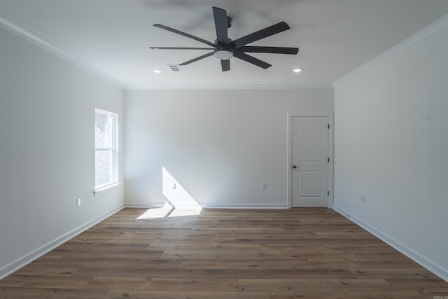 spare room with crown molding, dark wood-type flooring, and ceiling fan