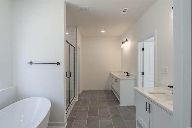 bathroom featuring vanity, separate shower and tub, and tile patterned flooring