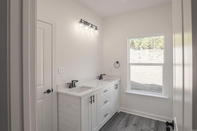 bathroom with vanity and wood-type flooring