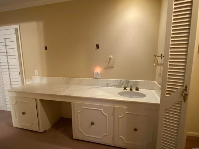 bathroom featuring vanity and crown molding