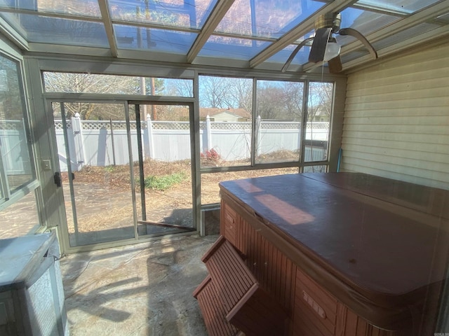 sunroom / solarium with vaulted ceiling and ceiling fan