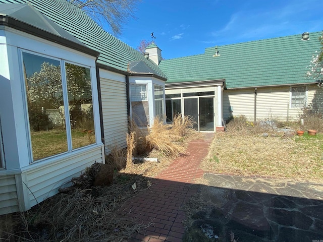 view of patio / terrace with a sunroom